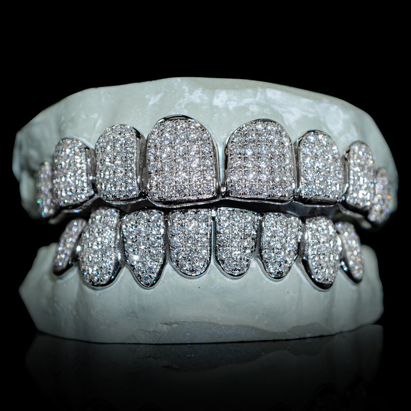 White gold grillz shown on the Custom Gold Grillz site