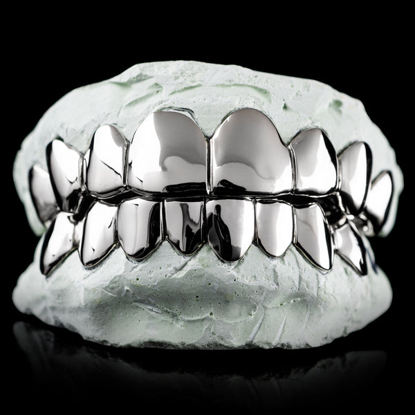 Polished sterling silver deep-cut grillz