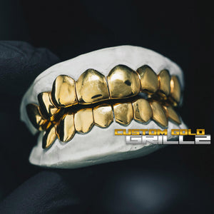 Solid Gold Deep Cut Custom-Made Grillz including Logo on Creative Background