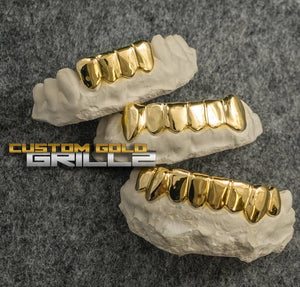 Solid Gold Custom-Made Grillz Bottom including Logo on Creative Background